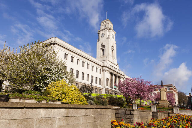Barnsley Town Hall, a historic landmark in Barnsley, surrounded by blooming flowers on a sunny day. Unblockers.net provides professional drain unblocking services throughout Barnsley for homes and businesses.