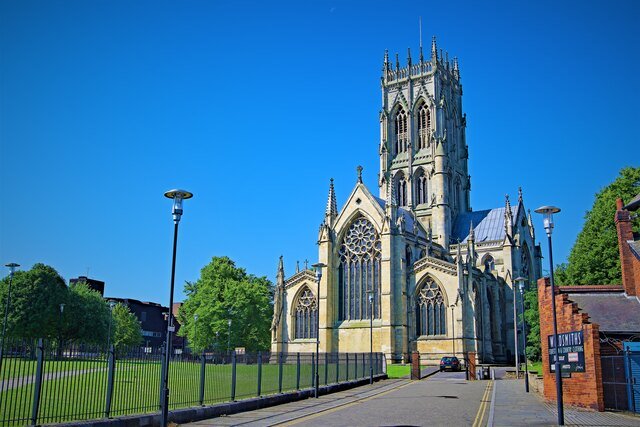 Doncaster Minster, a famous Gothic church in Doncaster, standing against a clear blue sky. Unblockers.net offers professional drain unblocking services throughout Doncaster to keep your drains flowing smoothly.