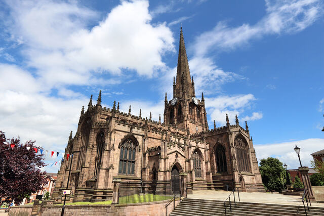 Rotherham Minster, a stunning Gothic church in Rotherham, set against a bright blue sky. Unblockers.net offers expert drain unblocking services throughout Rotherham to keep drainage systems running smoothly.