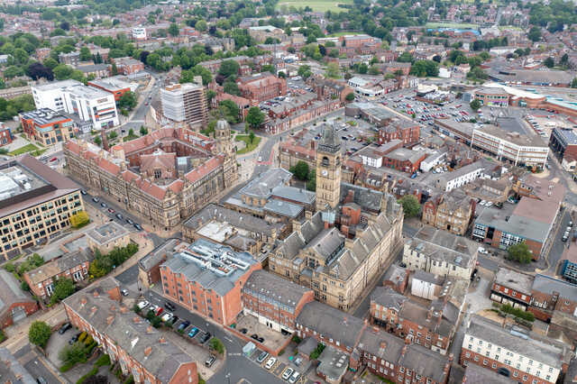 Aerial view of Wakefield Town Hall and surrounding cityscape. Unblockers.net provides expert drain unblocking services throughout Wakefield to keep drainage systems flowing smoothly.